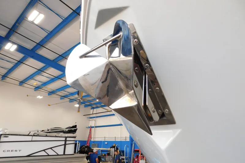 Slide: The Image of 2022 Pursuit S 328 Sport boat anchor detail in a blue-ceiling showroom. - 83