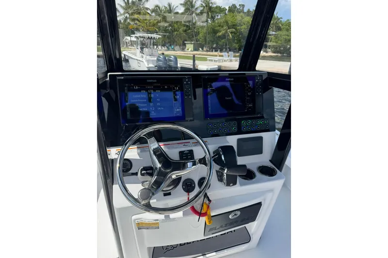 Slide: The Image of 2026 Blazer 2550 GTS boat dashboard with steering wheel and digital displays. - 1