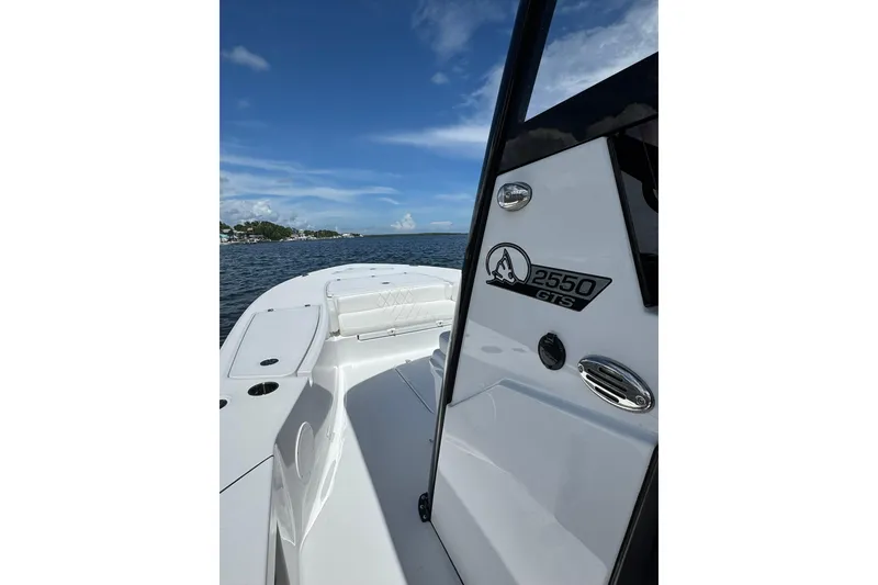Slide: The Image of 2026 Blazer 2550 GTS boat on water under clear blue sky. - 3