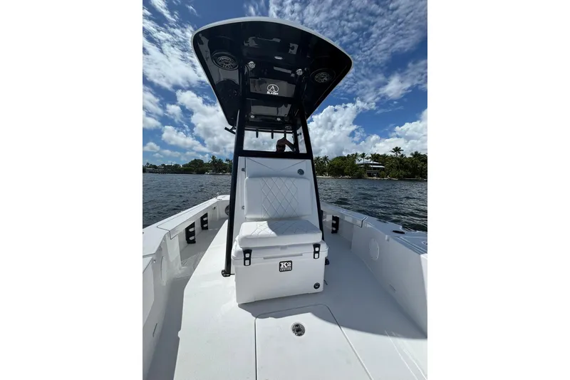 Slide: The Image of 2026 Blazer 2550 GTS boat with T-top, on open water under blue sky. - 5