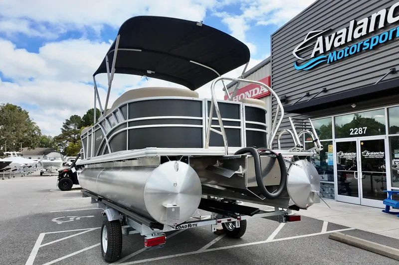 Slide: The Image of 2026 Sylvan Mirage 822 LZ pontoon boat on trailer at dealership. - 14