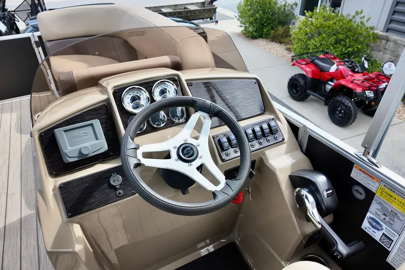 Slide: The Image of 2026 Sylvan Mirage 822 LZ boat dashboard with steering wheel and control panel. - 5