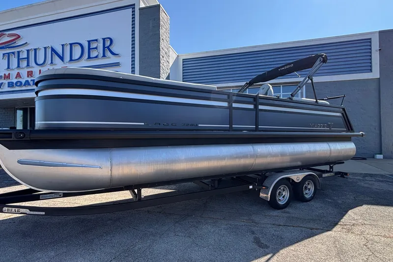 Slide: The Image of 2026 Viaggio Z24U pontoon boat on trailer outside Thunder Marine dealership. - 10