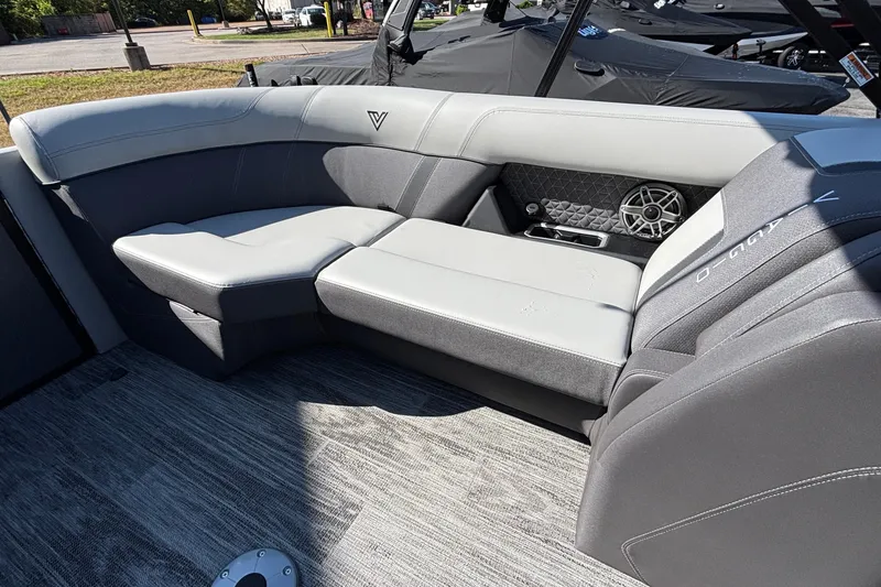 Slide: The Image of Luxurious seating in 2026 Viaggio Z24U boat, featuring gray upholstery and integrated speaker system. - 13