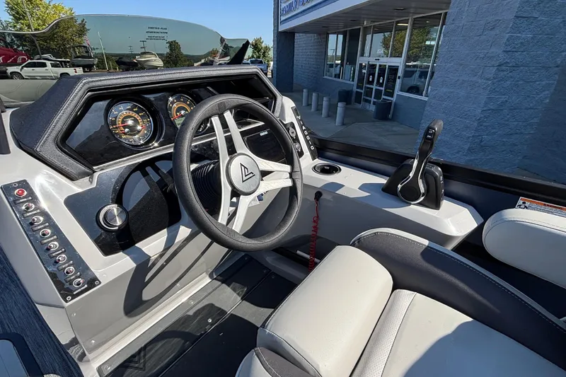 Slide: The Image of Interior of a 2026 Viaggio Z24U boat, featuring a modern steering wheel and dashboard controls. - 18