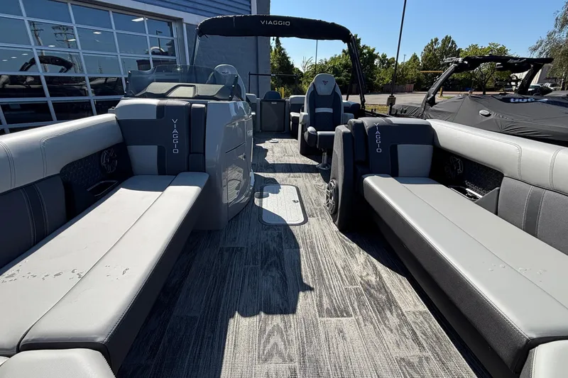 Slide: The Image of 2026 Viaggio Z24U pontoon boat interior with gray seating and modern design. - 22