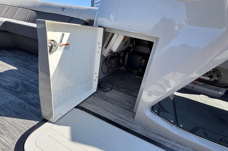 Slide: The Image of Open storage compartment on Viaggio Z24U boat, 2026 model, with visible interior components. - 34