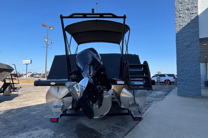 Slide: The Image of 2026 Viaggio Z24U pontoon boat with powerful outboard motor, parked outdoors. - 37