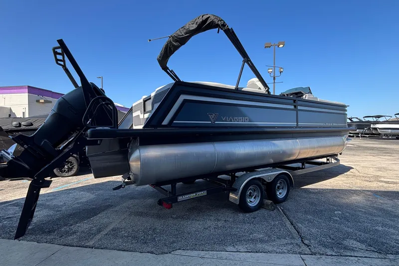 Slide: The Image of 2026 Viaggio Z24U pontoon boat on trailer, outdoor display under clear blue sky. - 5