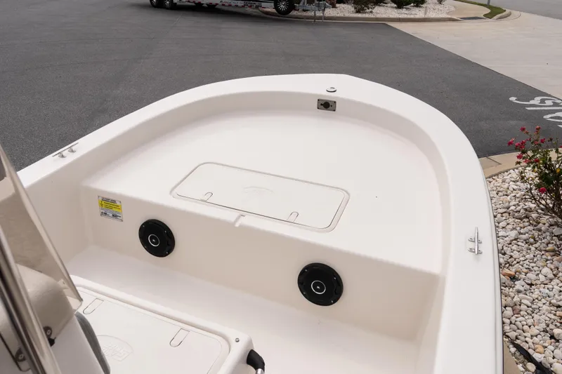 Slide: The Image of 2026 Carolina Skiff E18 JVX CC boat deck, featuring storage compartments and sleek design. - 10