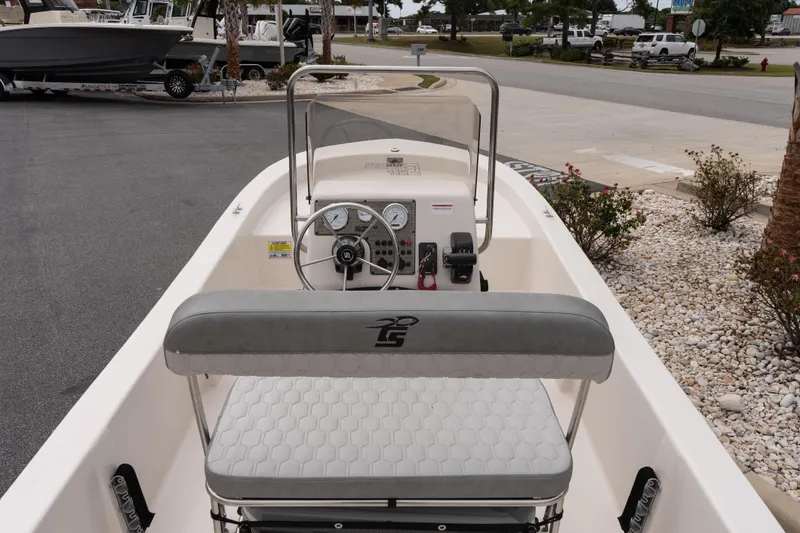 Slide: The Image of 2026 Carolina Skiff E18 JVX CC boat interior with steering console and seating. - 7