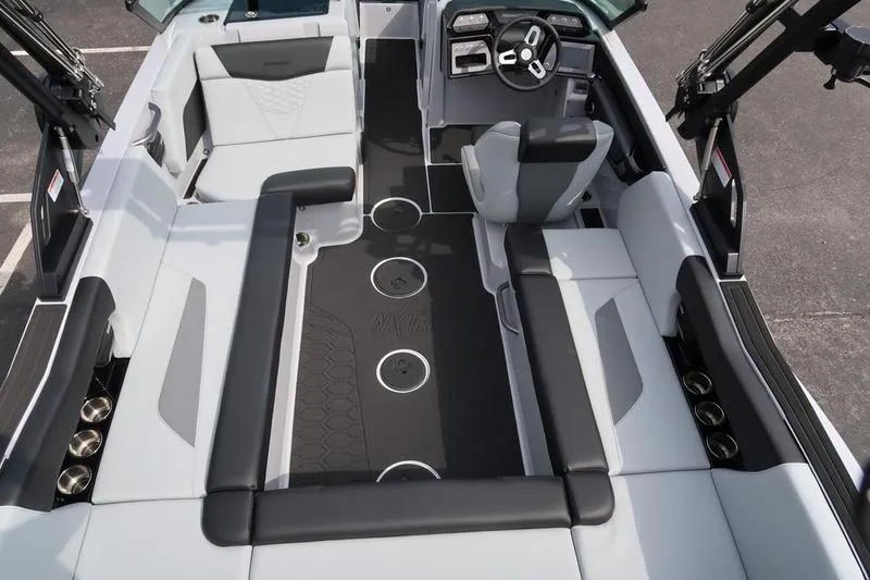 Slide: The Image of 2026 MasterCraft NXT22 boat interior with spacious seating and modern design. - 14