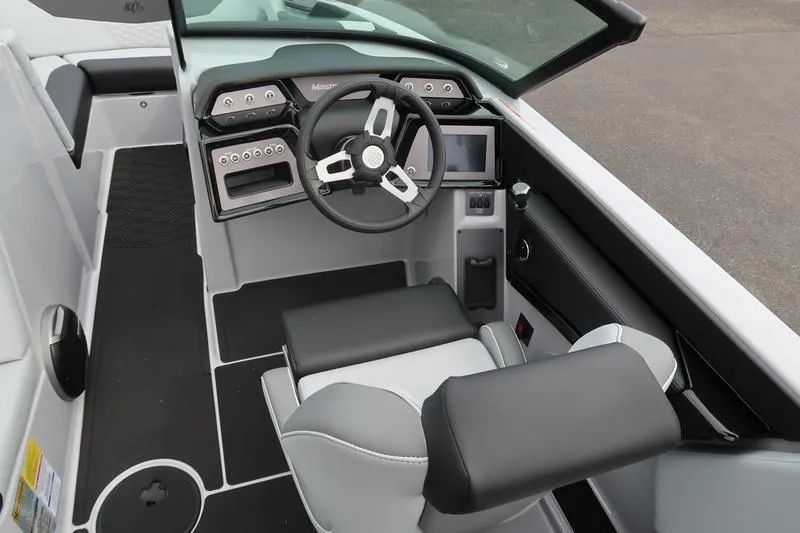 Slide: The Image of 2026 MasterCraft NXT22 engine compartment with Ilmor engine, showcasing blue components. - 18