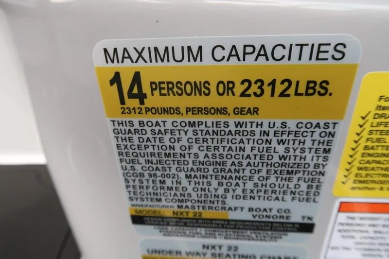 Slide: The Image of 2026 MasterCraft NXT22 boat interior with modern dashboard and steering wheel. - 20