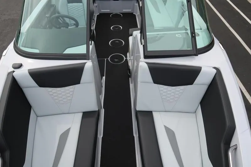 Slide: The Image of 2026 MasterCraft NXT22 boat interior with sleek seating and modern design. - 21