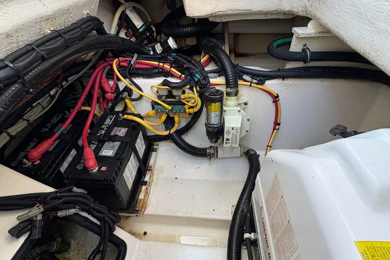 Slide: The Image of 2013 Pursuit OS 315 Offshore boat interior with seating and storage compartments. - 17