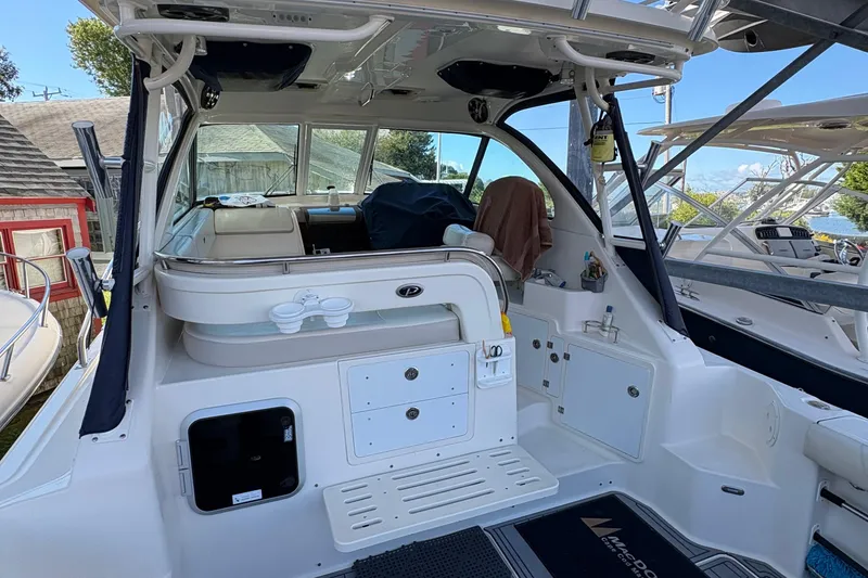 Slide: The Image of 2013 Pursuit OS 315 Offshore interior with Frigidaire microwave and Vizio TV. - 29