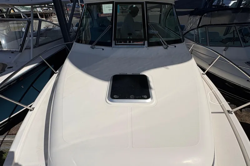 Slide: The Image of 2013 Pursuit OS 315 Offshore boat interior and exterior view in storage. - 35