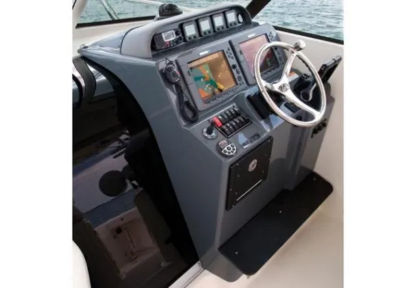 Slide: The Image of Manufacturer Provided Image: 2013 Pursuit OS 315 Offshore boat cruising on open water. - 5