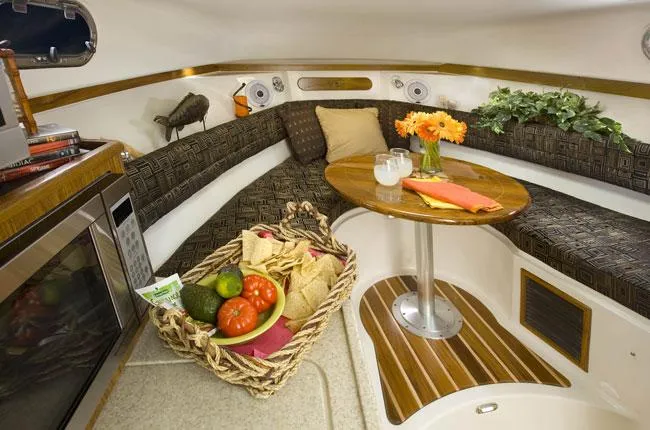 Slide: The Image of 2013 Pursuit OS 315 Offshore boat deck with Yamaha engines and fishing gear. - 8