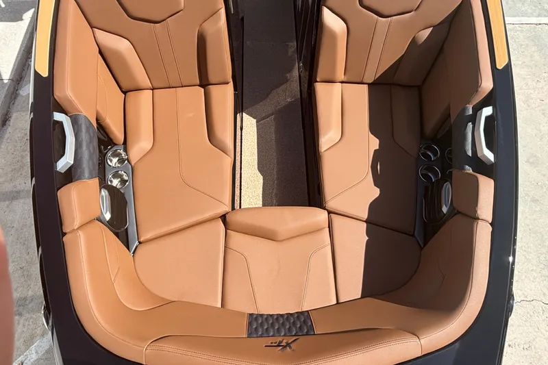 Slide: The Image of Luxurious tan leather seating in 2026 MasterCraft XT24 boat interior. - 12