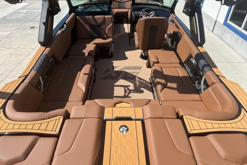 Slide: The Image of Luxurious interior of 2026 MasterCraft XT24 boat with brown seating and modern design. - 5