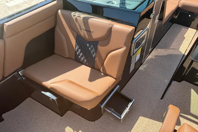 Slide: The Image of 2026 MasterCraft XT24 boat interior with tan seating and sleek design. - 9