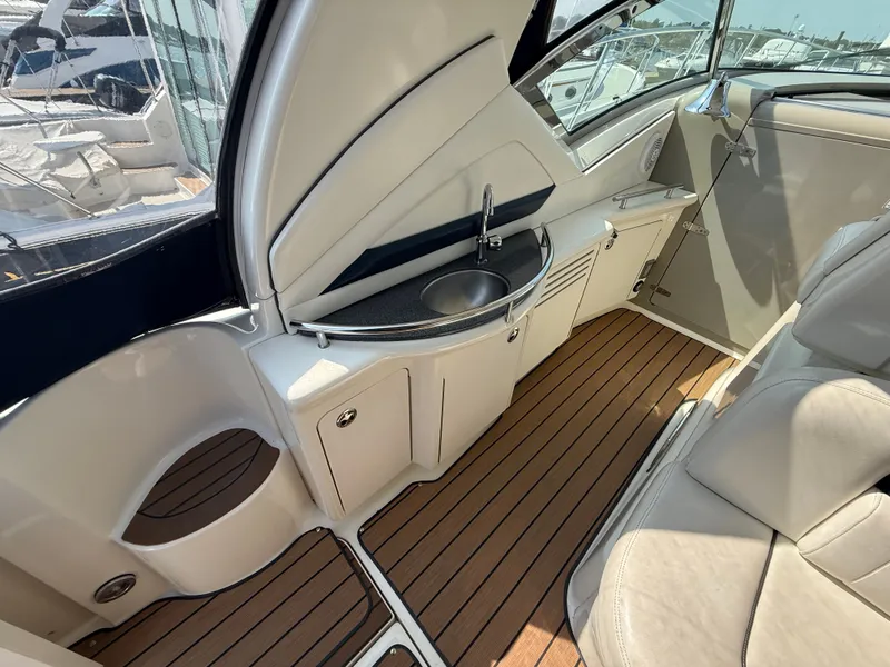 Slide: The Image of 2004 Sea Ray 390 Sundancer interior with sink and wooden flooring. - 4
