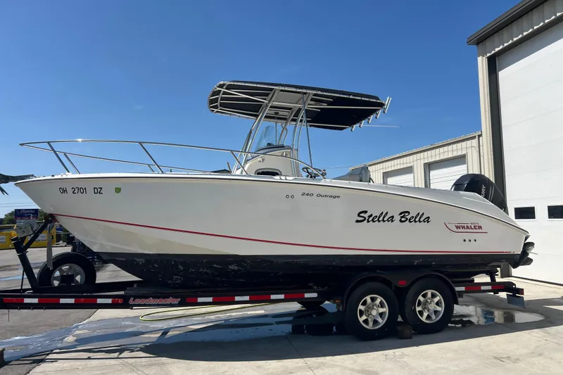 The Image of 2006 Boston Whaler 240 Outrage boat on trailer, parked outside Clemons Boats dealership. - 0