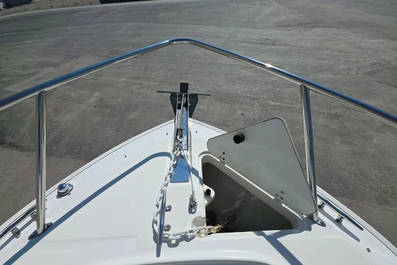 Slide: The Image of Bow of 2006 Boston Whaler 240 Outrage with anchor storage open. - 13