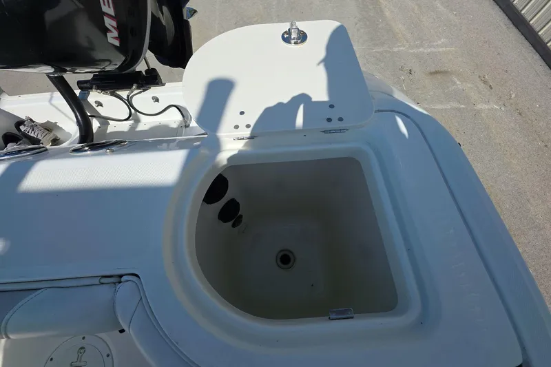 Slide: The Image of Open storage compartment on a 2006 Boston Whaler 240 Outrage boat. - 22