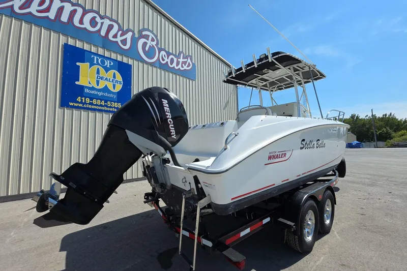 Slide: The Image of 2006 Boston Whaler 240 Outrage boat on trailer, displayed at Clemons Boats dealership. - 4