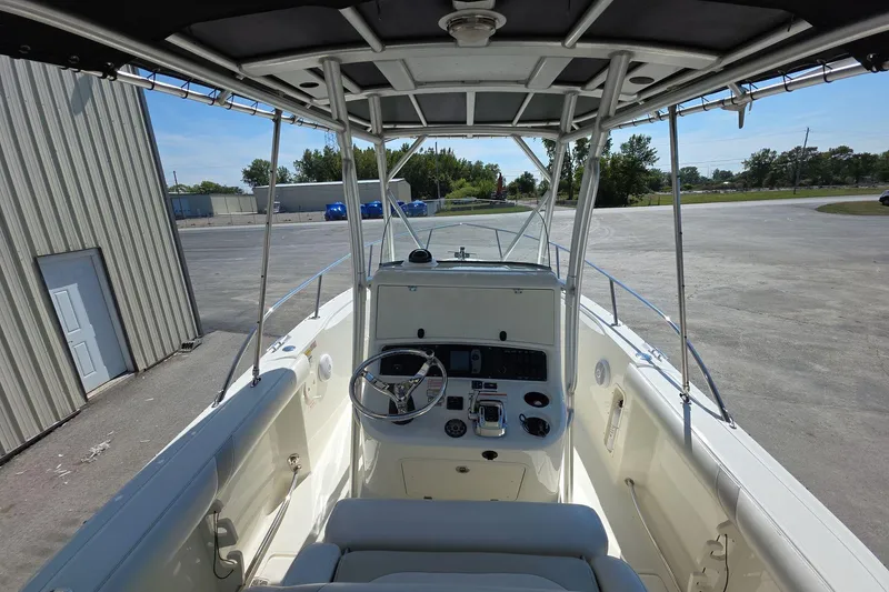 Slide: The Image of 2006 Boston Whaler 240 Outrage boat interior with steering console and seating. - 7