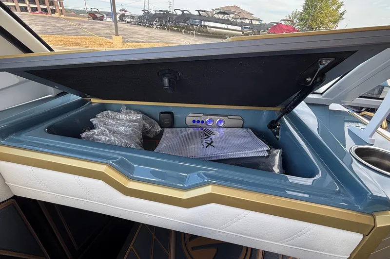 Slide: The Image of 2026 Tigé Ultré 25ZX boat storage compartment with modern design and accessories. - 10