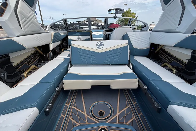 Slide: The Image of 2026 Tigé Ultré 25ZX boat interior with blue and white seating, modern design. - 14