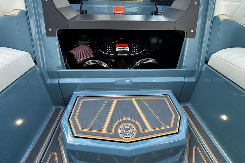Slide: The Image of 2026 Tigé Ultré 25ZX boat interior with engine compartment and stylish flooring. - 27