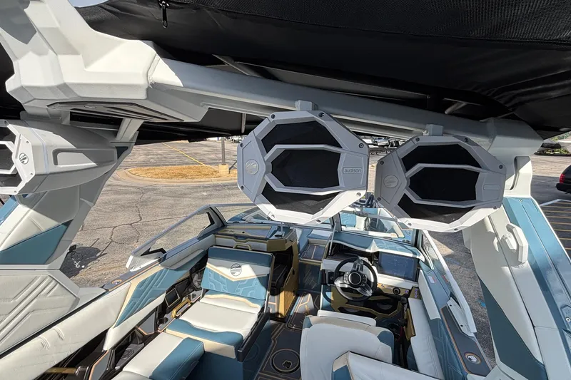Slide: The Image of 2026 Tigé Ultré 25ZX boat interior with premium audio system and modern seating design. - 36
