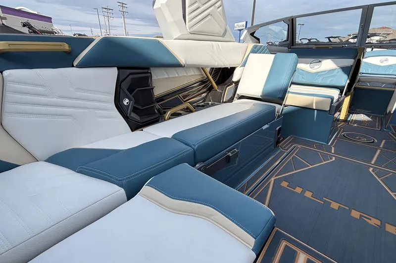 Slide: The Image of 2026 Tigé Ultré 25ZX boat interior with luxurious blue and white seating. - 37
