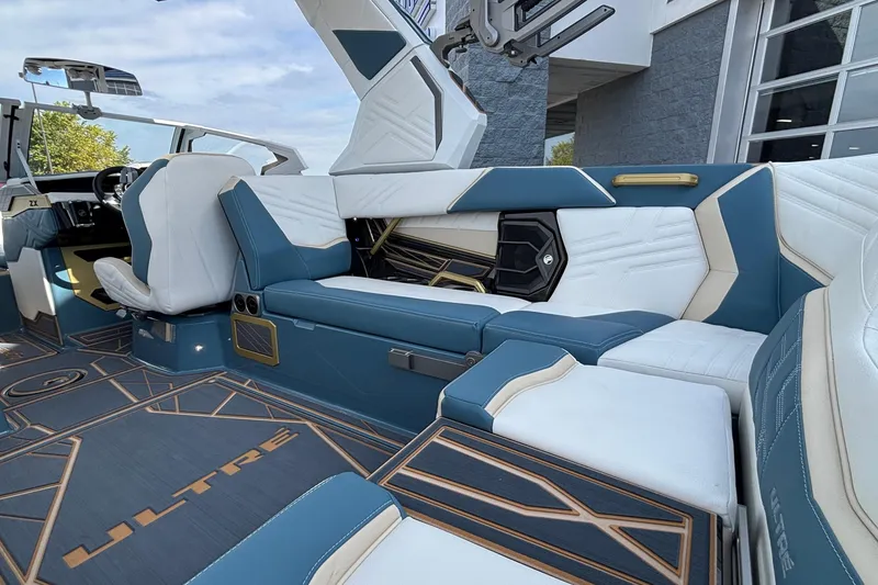 Slide: The Image of Luxurious interior of 2026 Tigé Ultré 25ZX boat with stylish seating and modern design. - 38