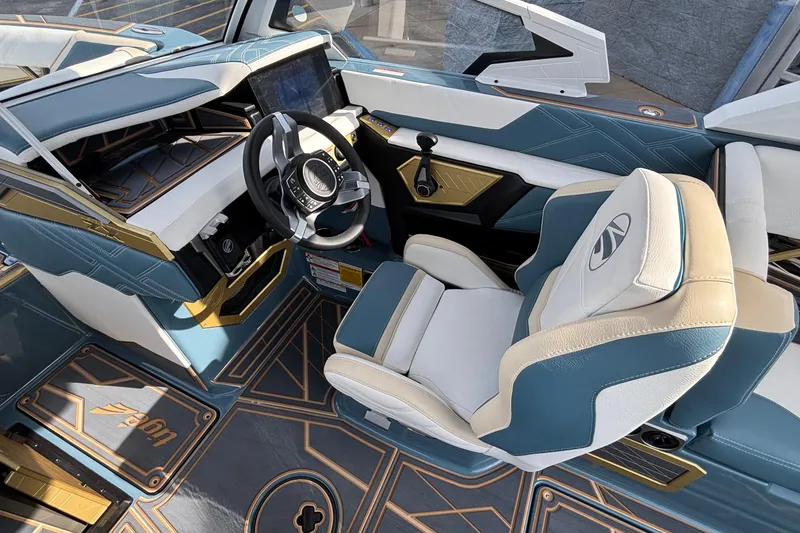 Slide: The Image of 2026 Tigé Ultré 25ZX boat interior with modern steering wheel and luxurious seating. - 46