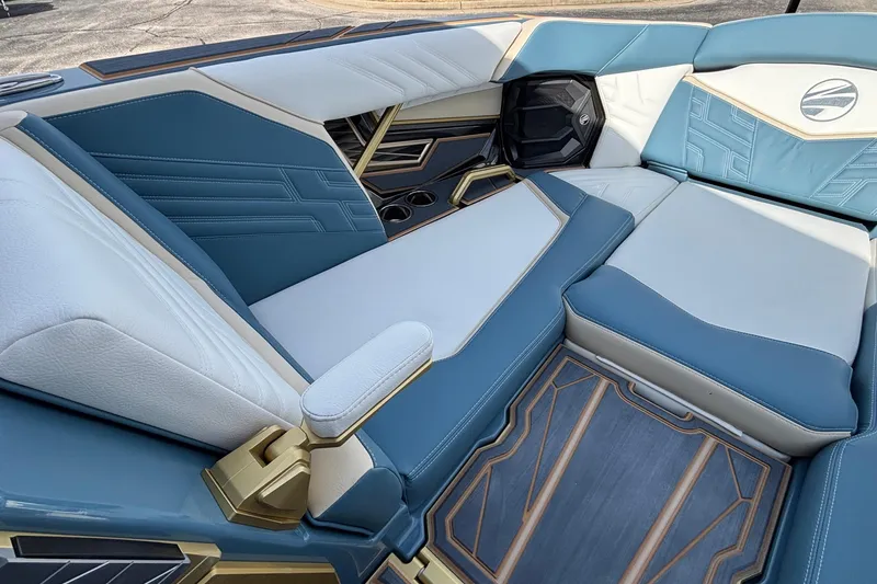 Slide: The Image of 2026 Tigé Ultré 25ZX boat interior with luxurious blue and white seating. - 52