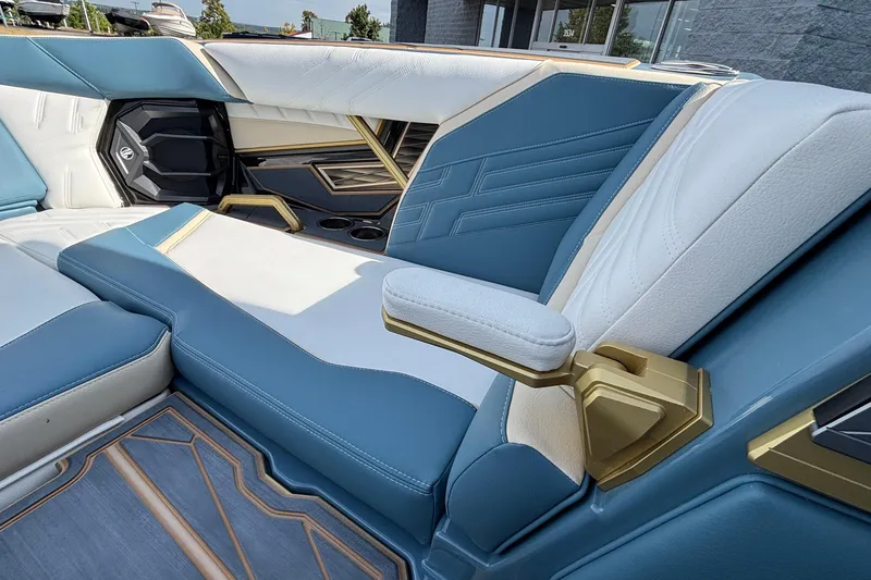 Slide: The Image of Luxurious interior of 2026 Tigé Ultré 25ZX boat with blue and white seating. - 54