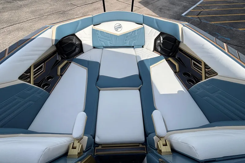 Slide: The Image of Luxurious interior of 2026 Tigé Ultré 25ZX boat with blue and white seating. - 59
