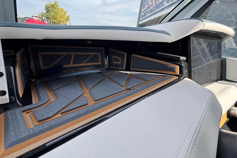 Slide: The Image of 2026 Tigé Ultré 25ZX boat interior with modern design and sleek upholstery. - 61