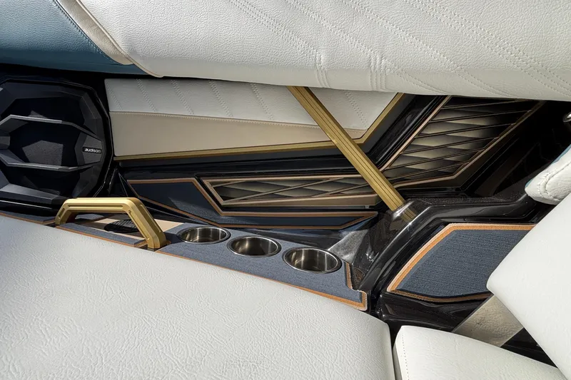 Slide: The Image of 2026 Tigé Ultré 25ZX interior with luxurious seating, cup holders, and premium speaker system. - 63