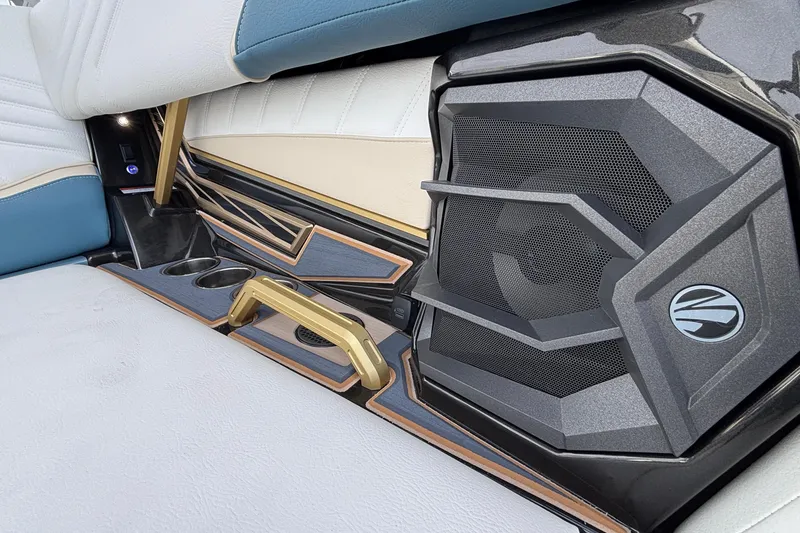 Slide: The Image of Luxurious interior of 2026 Tigé Ultré 25ZX boat with premium speaker system. - 64