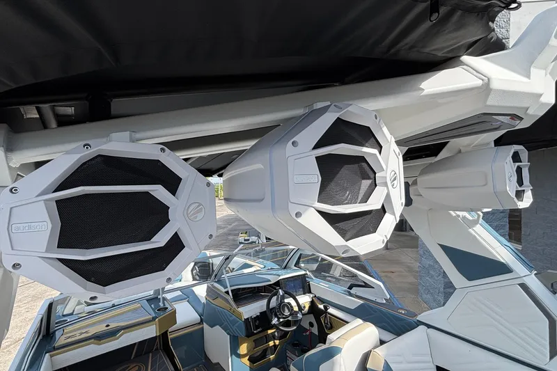 Slide: The Image of 2026 Tigé Ultré 25ZX boat with premium Audison speakers and modern interior design. - 65