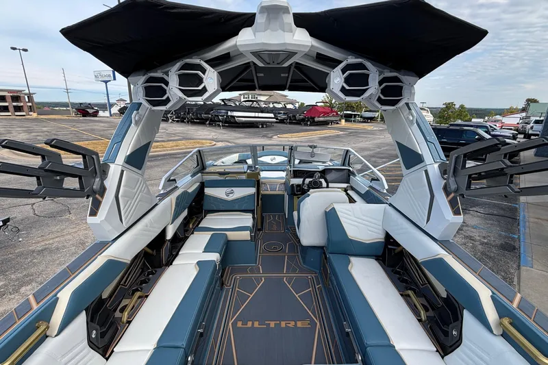 Slide: The Image of 2026 Tigé Ultré 25ZX boat interior with modern seating and advanced audio system. - 9