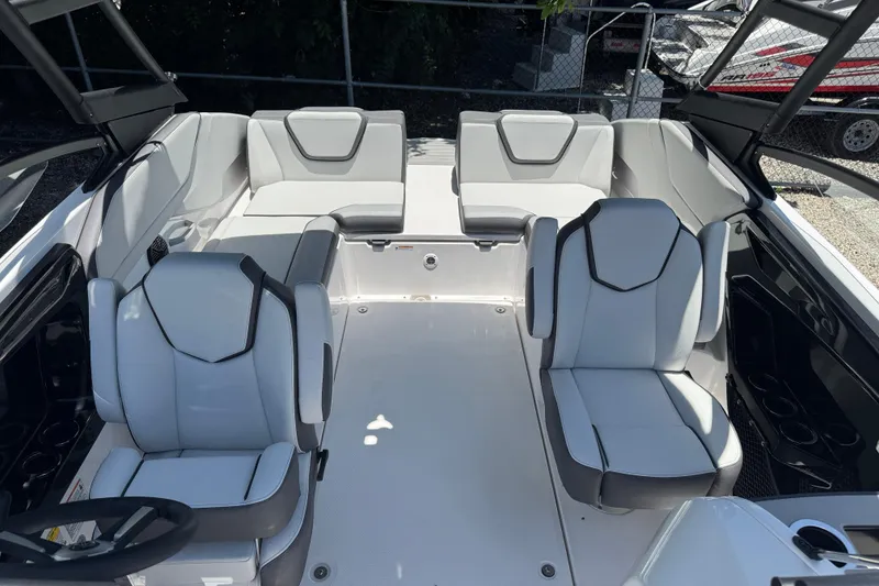 Slide: The Image of 2025 Yamaha Boats AR250 interior with modern seating and sleek design. - 12