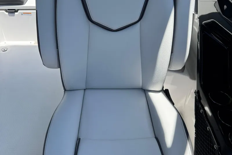 Slide: The Image of 2025 Yamaha Boats AR250 seat with sleek white upholstery and black accents. - 18